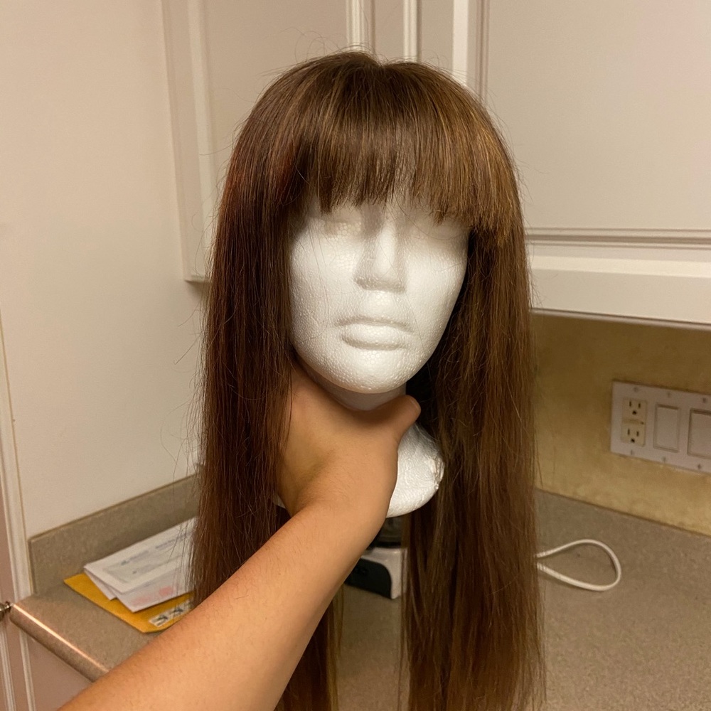 Custom made human hair wig with bangs.